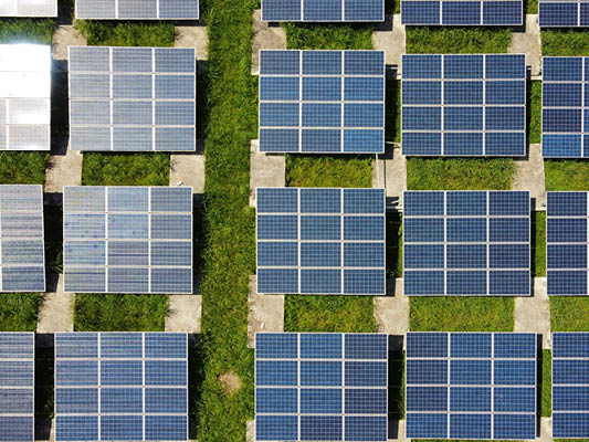 Birdseye view of solar panels on a field
